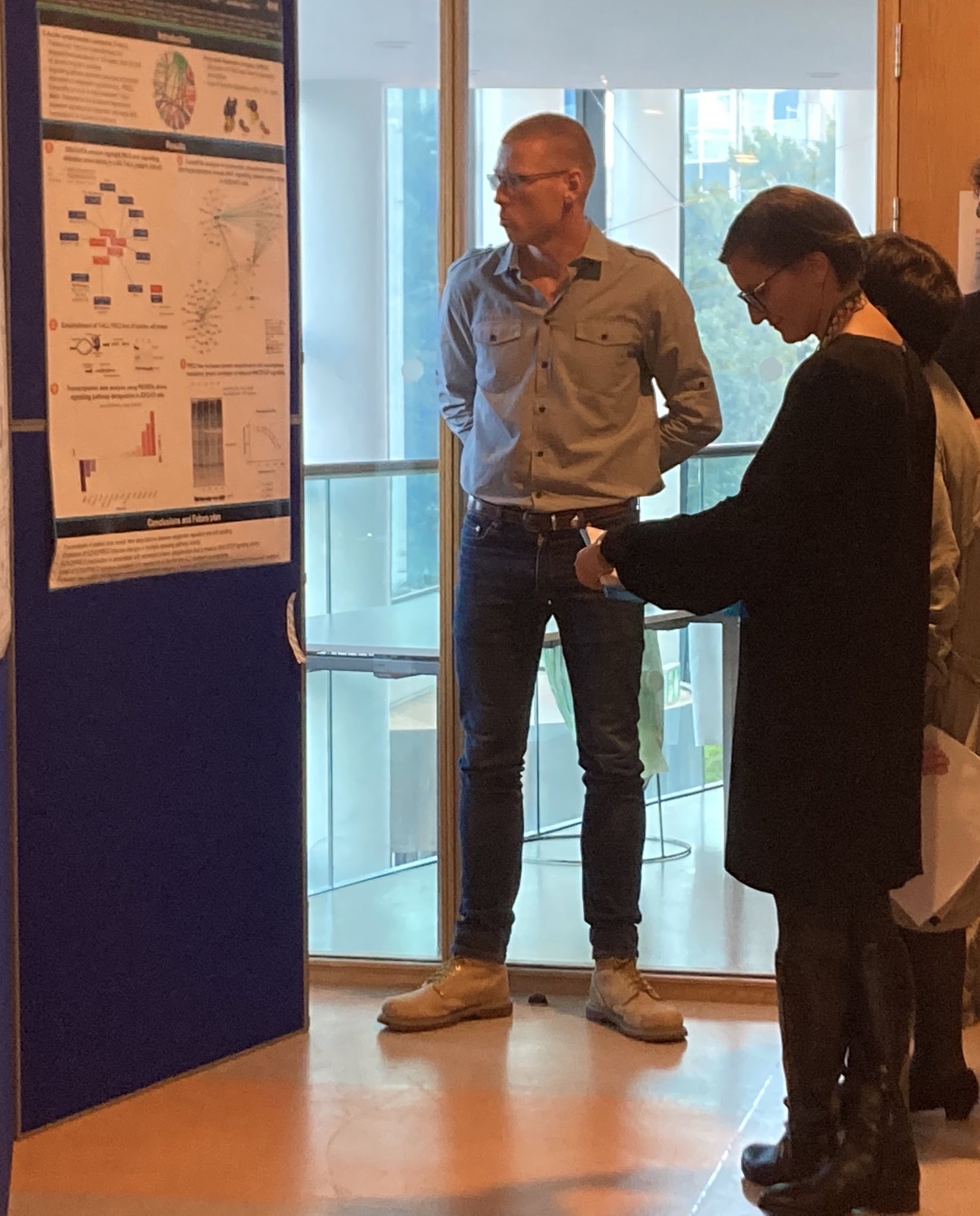 Thomas presenting his poster